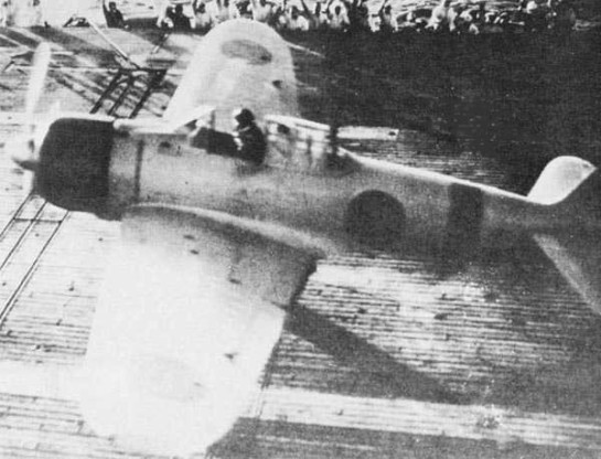 Flight Officer 1st Class Shinpei Sano launches from the flight deck of the Akagi in an A6M2 model 21 Zero after sunrise in the second attack wave. Sano died in the Battle of Midway in June, 1942.